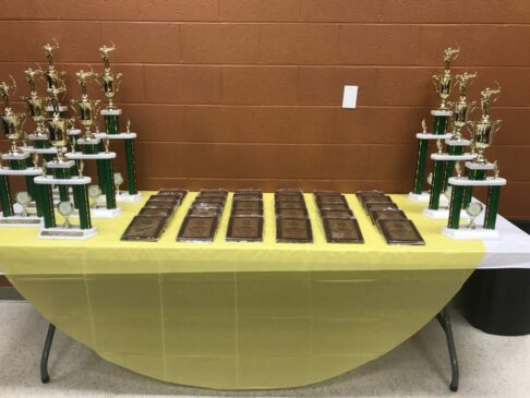 Table with student trophies and awards