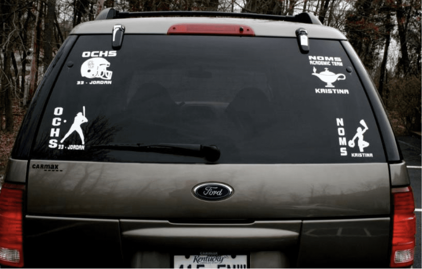 Students and athletes decals on the back of a scorecard