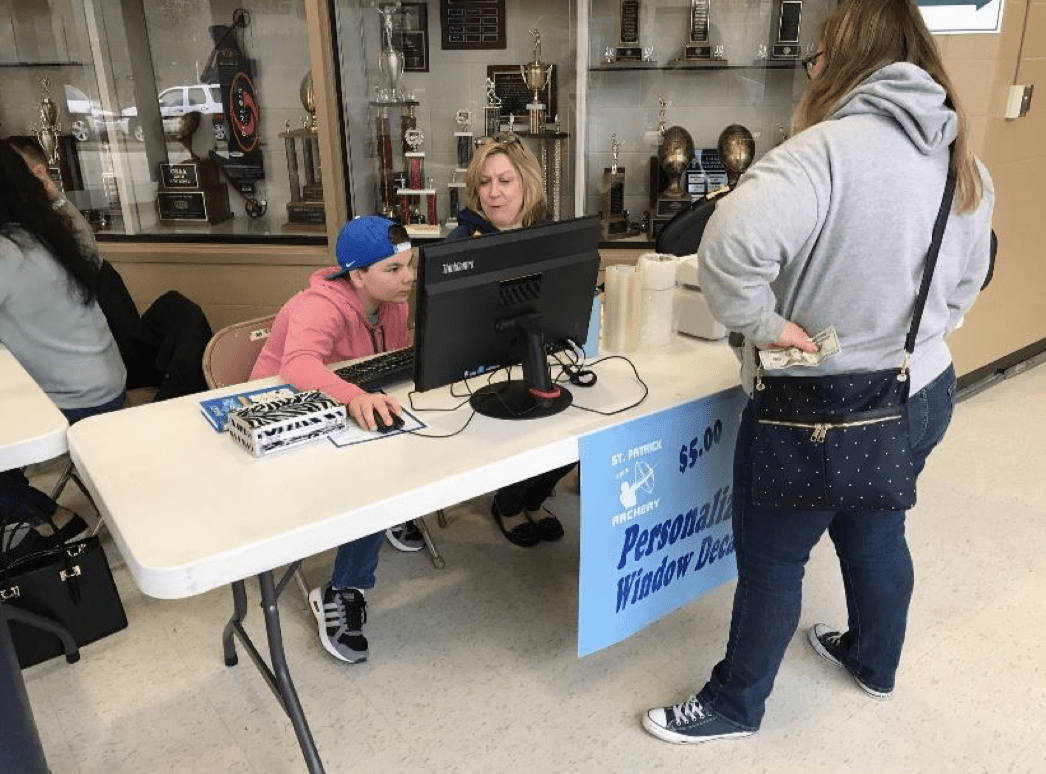 Students operating the recognizer for a school fundraiser