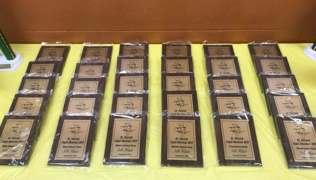 Table full of student awards and plaques