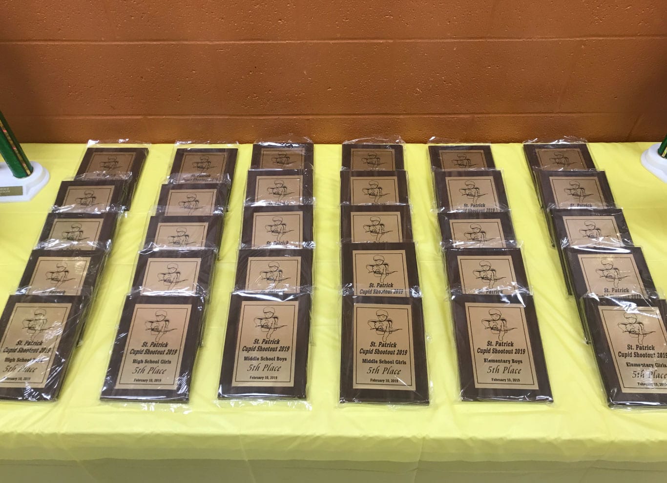 Table full of student awards and plaques