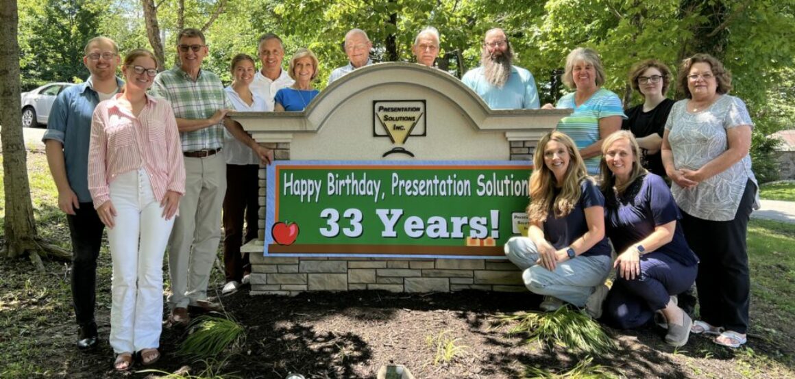 Presentation Solutions' Team Standing outside their office ready to supply poster makers for schools.