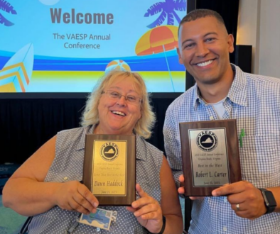 School administrators holding awards